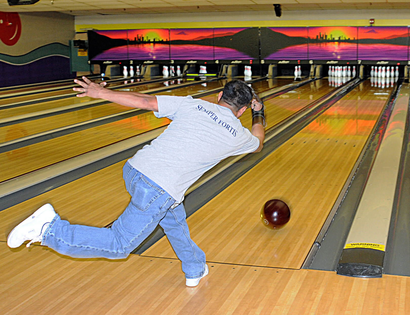 US_Navy_090819-N-2259V-119_A_Sailor_releases_the_ball_down_the_lane_at_a_bowling_competition_during_the_2009_San_Diego_Surface_Line_Week